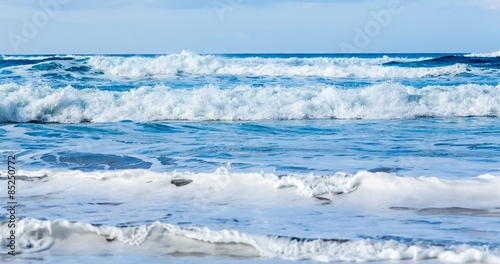 Rows of waves coming to shore