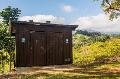 Wooden restroom in forest photo