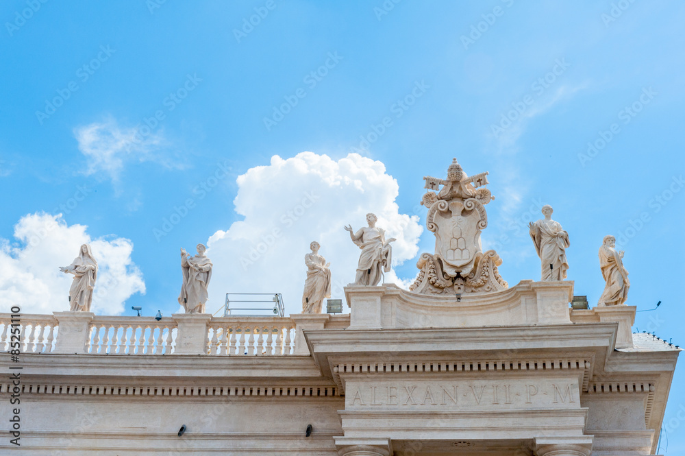 View of St Peter square statue up on Bernini's colonnade