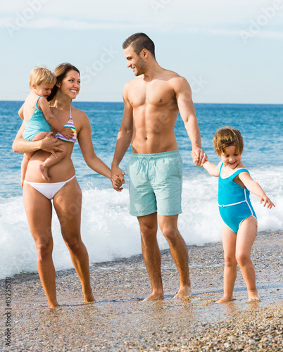 Family of four at the beach © JackF