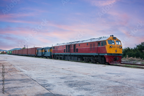 Cargo train and container at twilight
