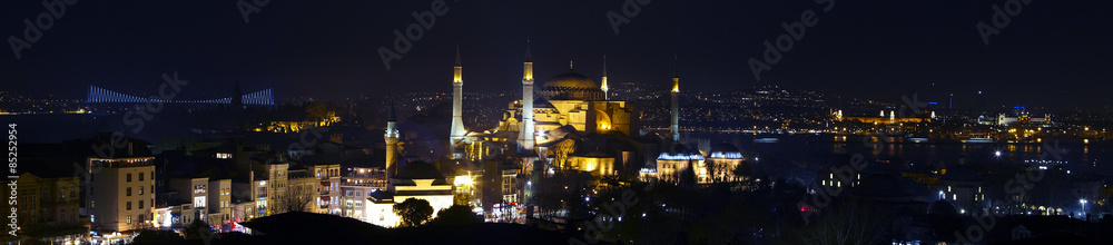 Wide angle panorama of Istanbul old city district nightlight illumination Large panorama including most famous attractions Sophia Blue Mosque water  Bosporus and Asian side town on background