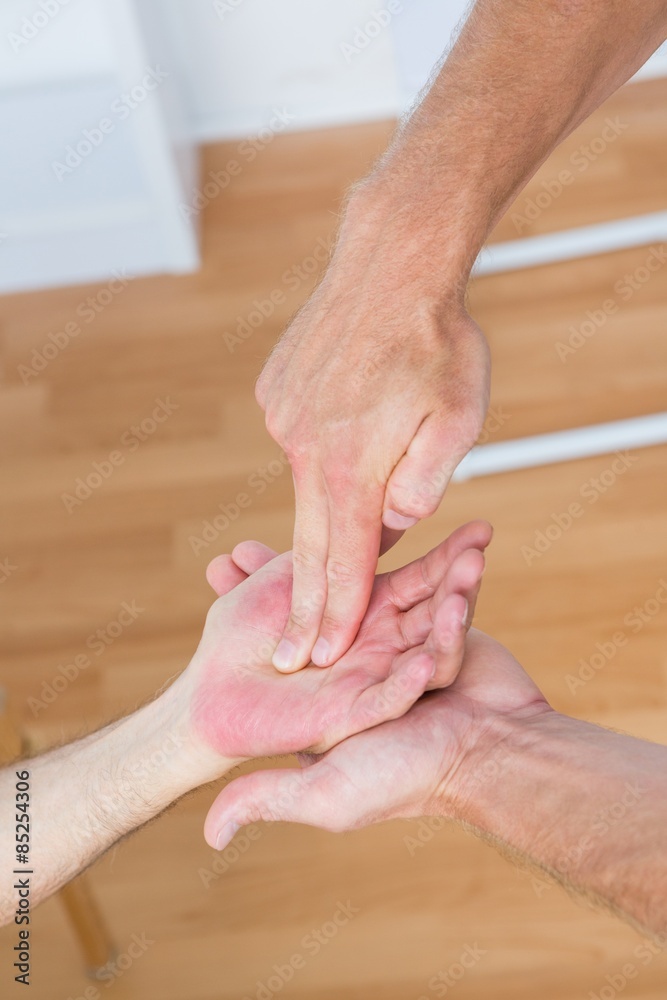 Physiotherapist doing hand massage Physiotherapist doing hand massage