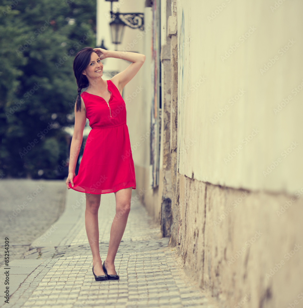 Beautiful brunette girl with red outfit