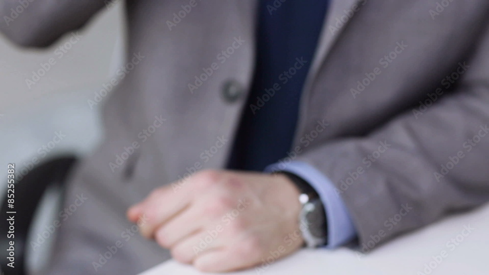close up of businessman calling on smartphone close up of businessman calling on smartphone