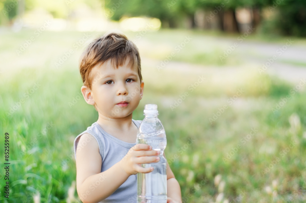 Boy holding a water bottle