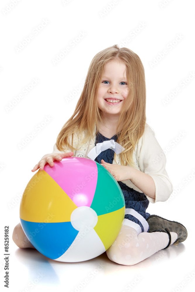Beautiful long-haired blonde girl with a big ball in his hands Beautiful long-haired blonde girl with a big ball in his hands
