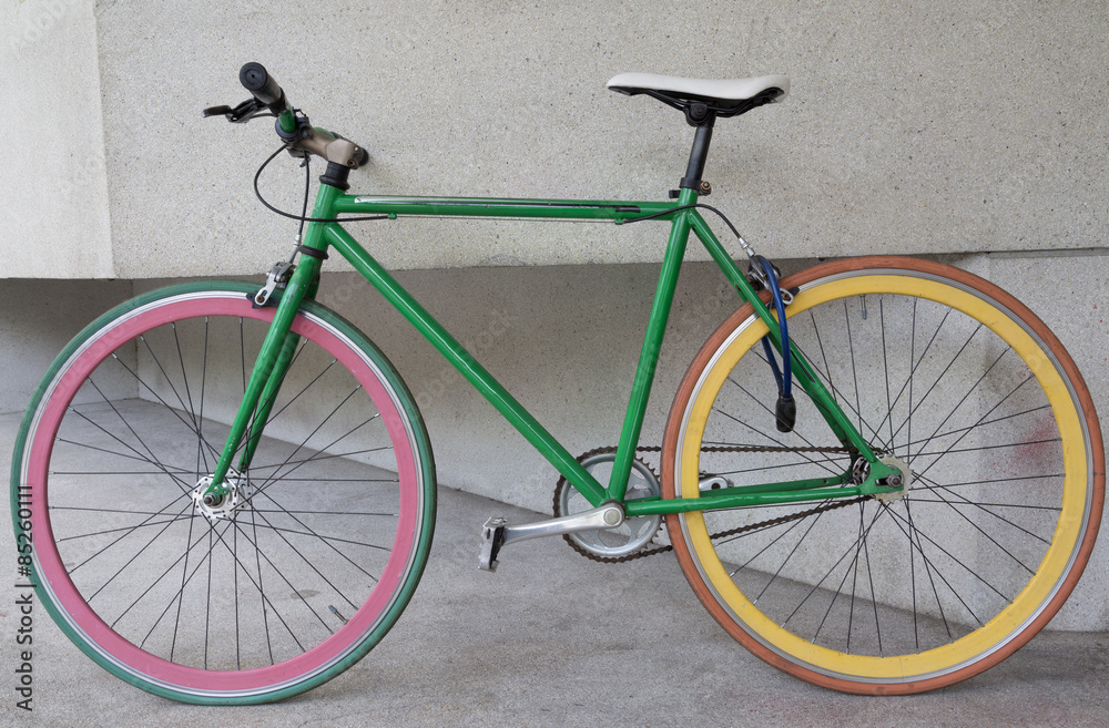 green fixed gear bicycle at building green fixed gear bicycle at building