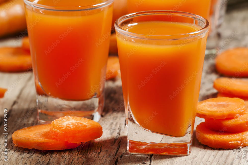 Fresh carrot juice in the glass, selective focus Fresh carrot juice in the glass, selective focus