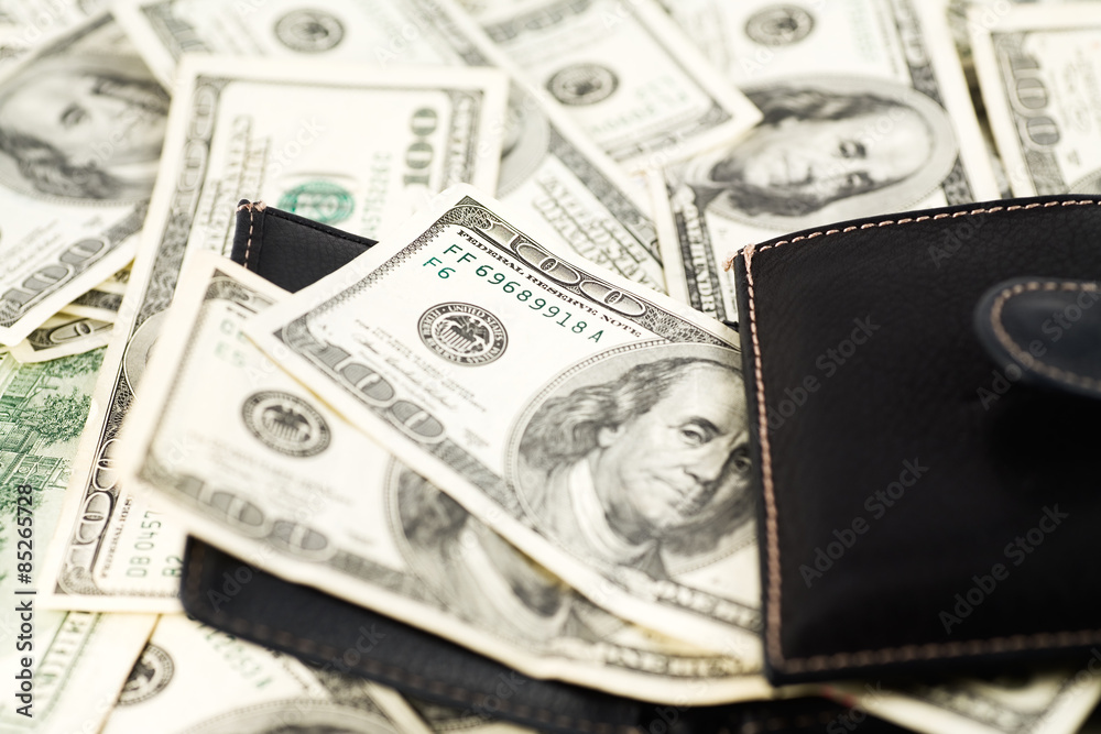 US Currency, $100 Bills and black wallet US Currency, $100 Bills and black wallet