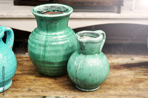 Old ceramic jug on the vintage table