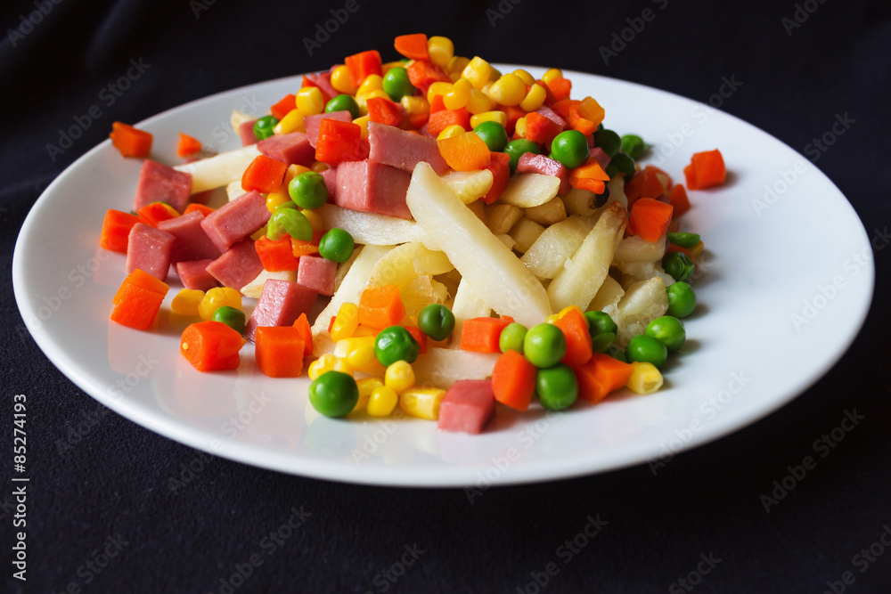 cooked food, french fries and vegetables on a white plate
