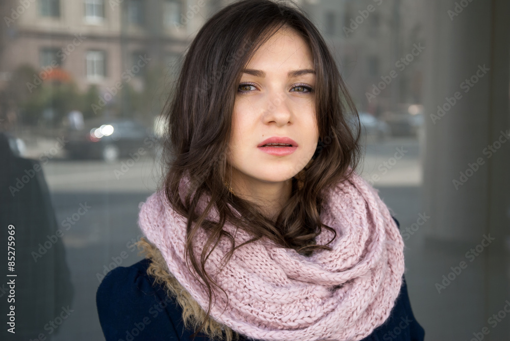 attractive girl in comforter and her serious look attractive girl in comforter and her serious look
