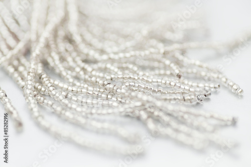 Glass Beads on silver background. 