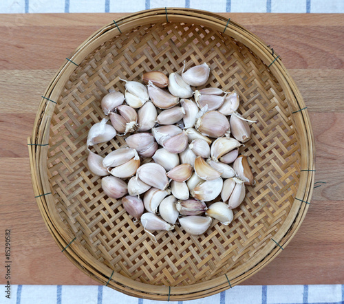 garlics on woven basket photo