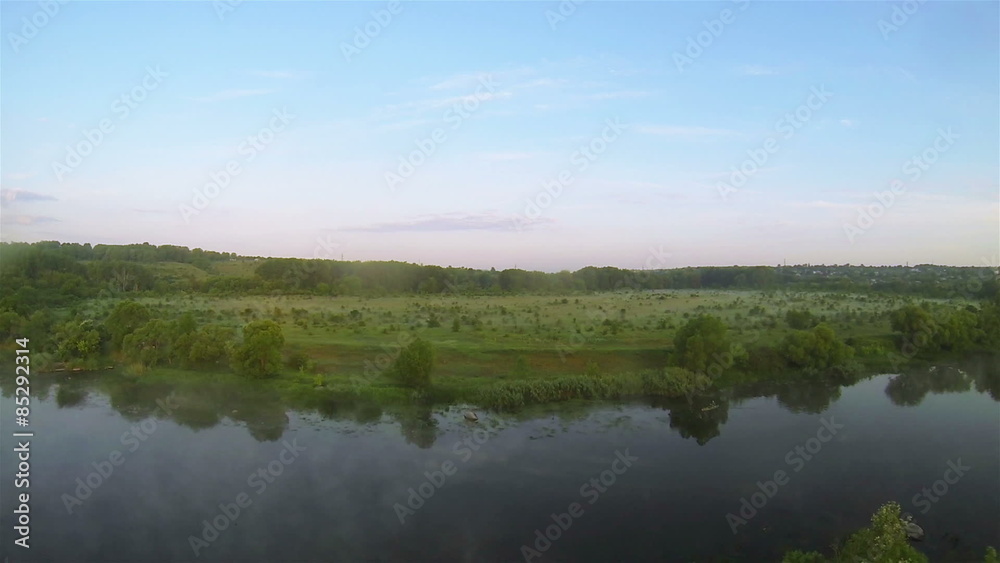 Slow fly over evening river and clouds. Aerial Slow fly over evening river and clouds. Aerial