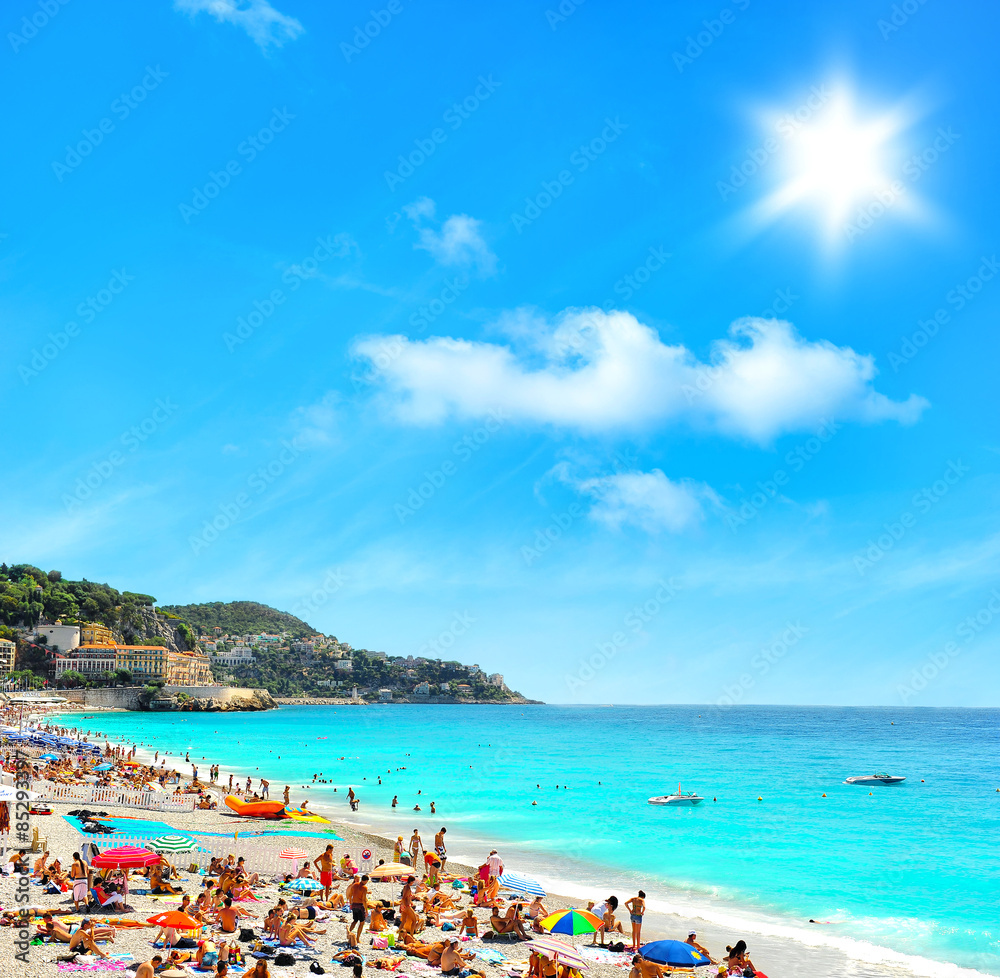 Tourists, sunbeds and umbrellas on hot day. Travel background