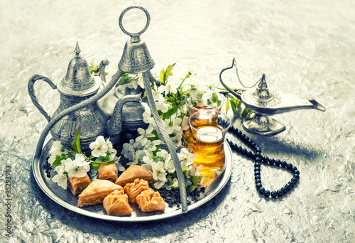 Islamic holidays food with decoration. Ramadan kareem. Vintage s photo