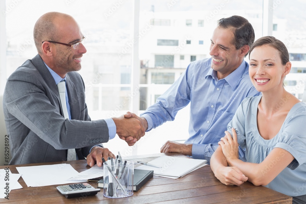 Businessman shaking hands with a co worker Businessman shaking hands with a co worker