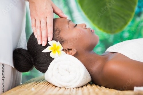 Pretty woman enjoying a head massage