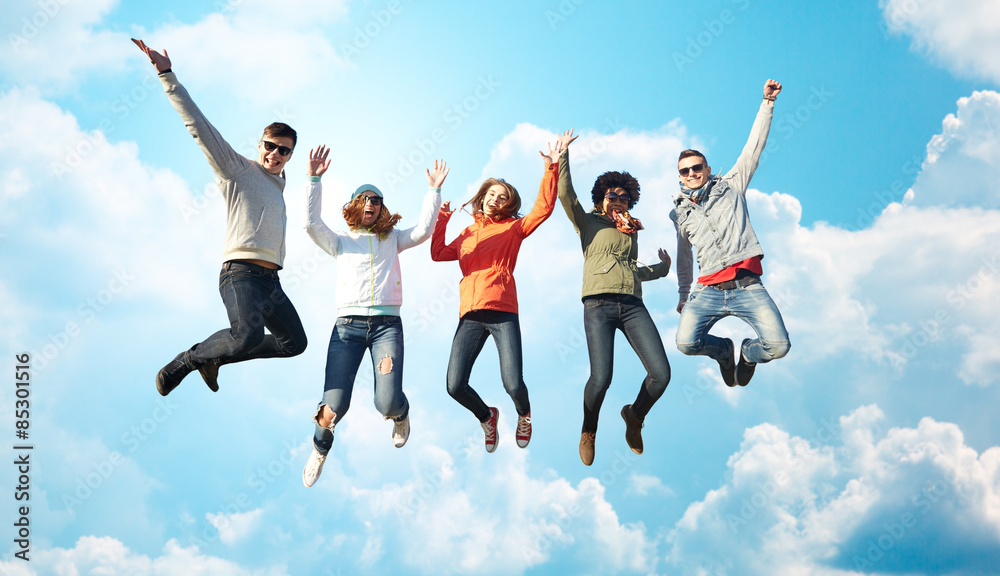 smiling friends in sunglasses jumping high smiling friends in sunglasses jumping high