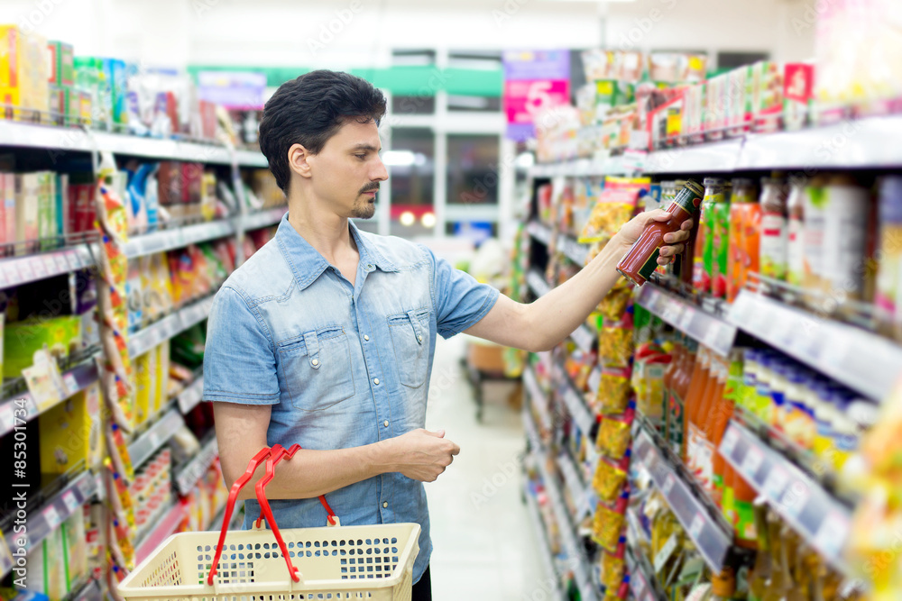 man in a supermarket to buy ketchup