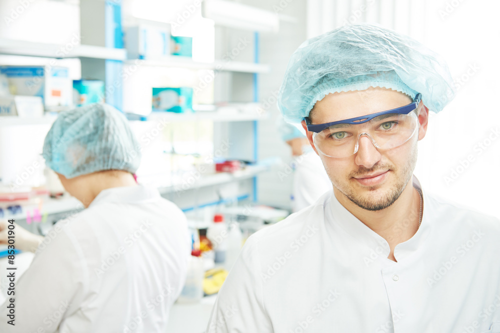 Chemist researchers workers in laboratory