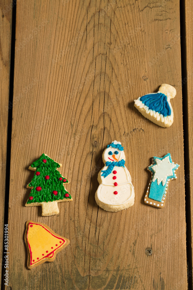 Sweet decorative food for holidays/Christmas cookies on picnic table Sweet decorative food for holidays/Christmas cookies on picnic table