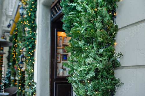 Open door with decorated Christmas tree