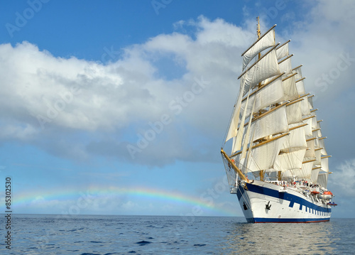 Sailing ship on the background of the rainbow