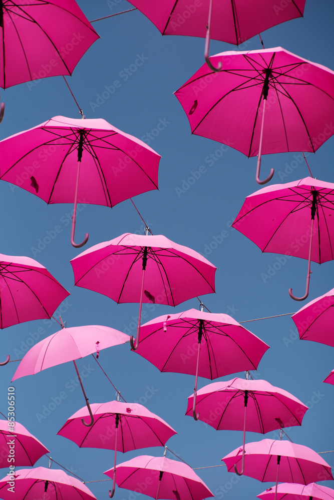 Pink parasols in the air