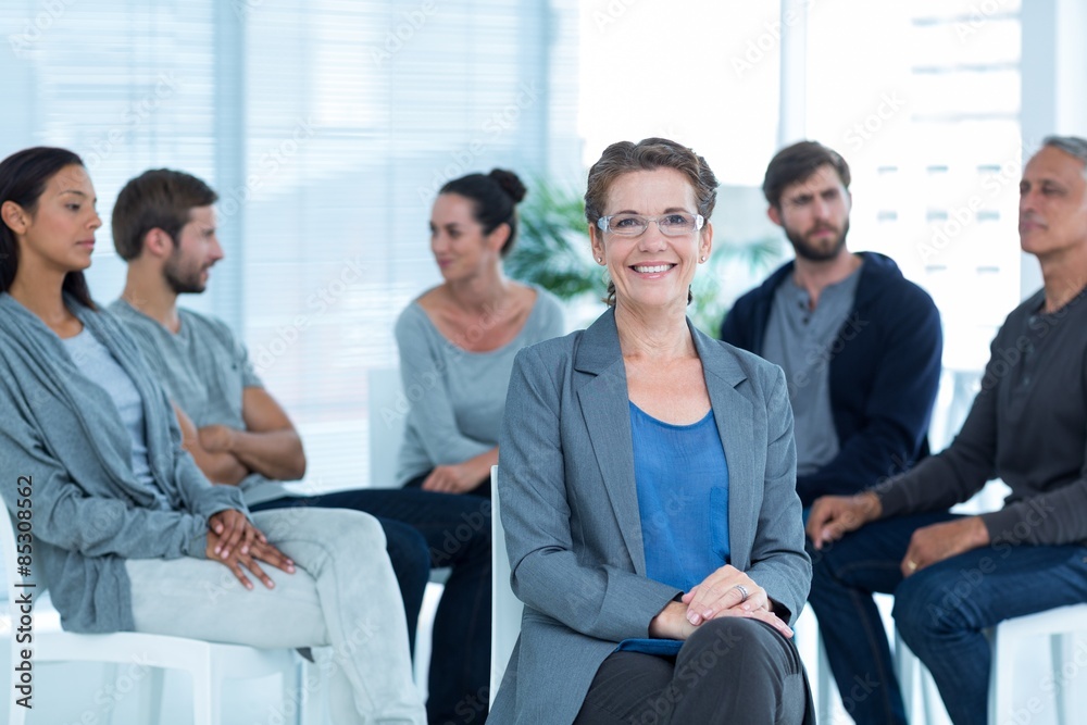 Therapist with group therapy in session Therapist with group therapy in session