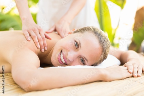 Attractive woman getting massage on her back