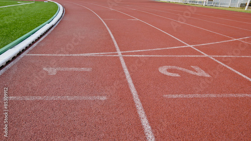 Athletic running track with number one two in stadium