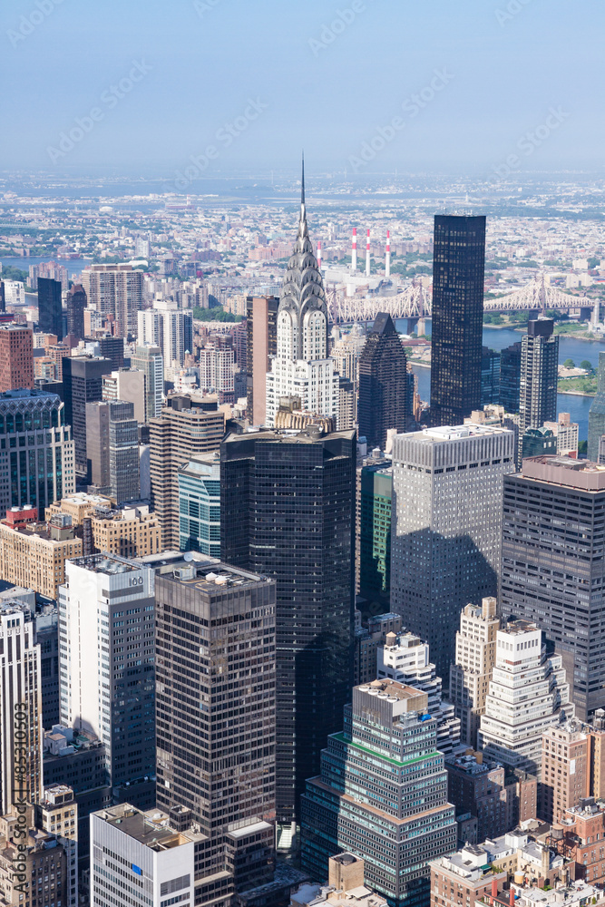 New York, panoramic view of Midtown Manhattan as seen from the Empire State Building observation deck, in the center of the framing the Chrysler Building