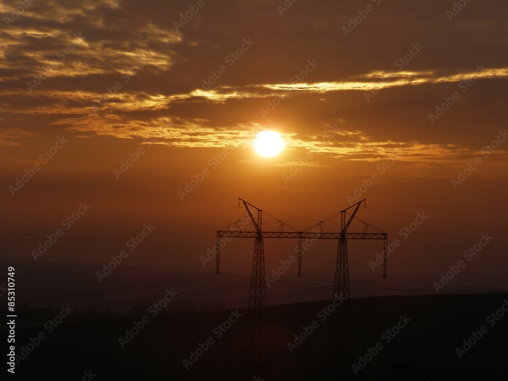 Obraz premium Electric pillar.Electric pylons at sunset.