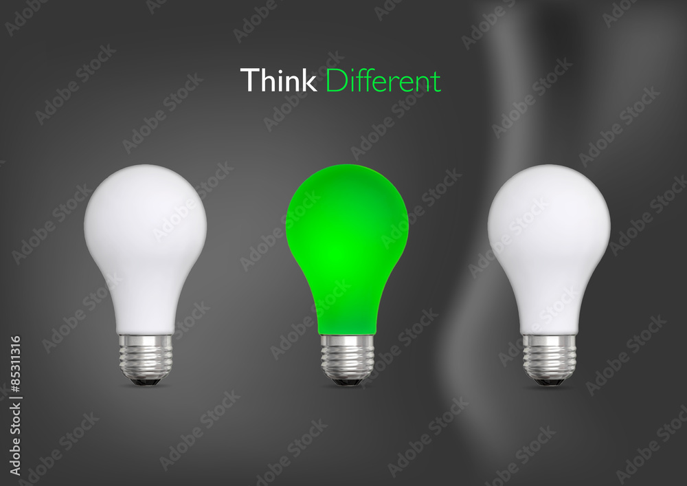three bulbs one green and two white, think different on dark gray background three bulbs one green and two white, think different on dark gray background