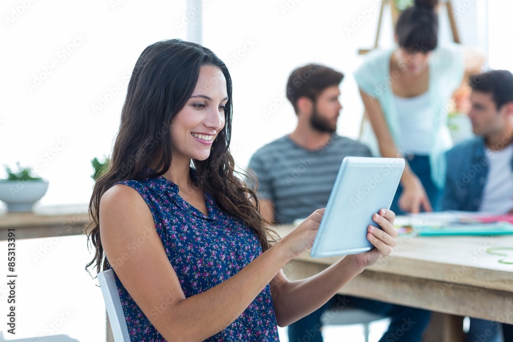 Smiling young women using digital tablet Smiling young women using digital tablet