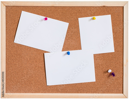 Blank papers pin up on cork board isolated on white background
