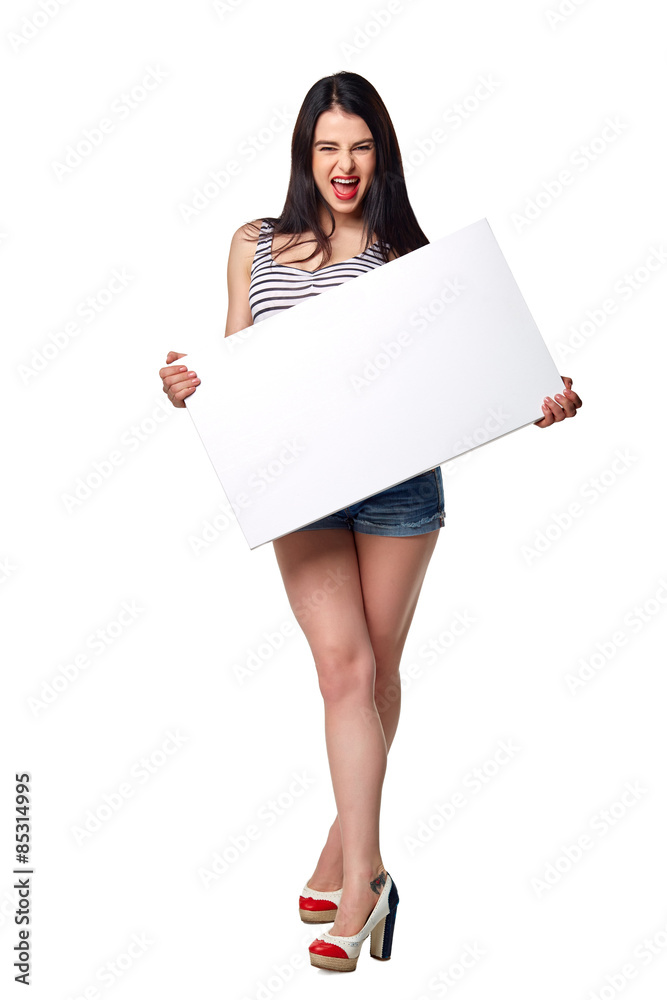 Full length of beautiful woman standing behind, holding white bl Full length of beautiful woman standing behind, holding white bl