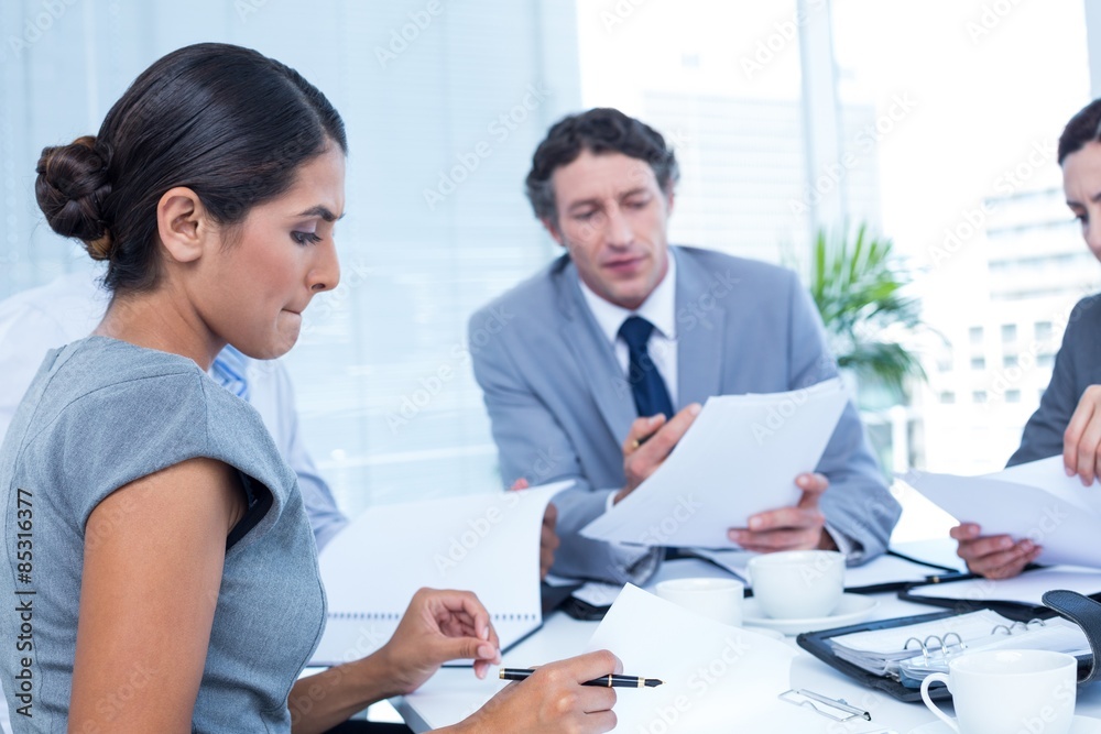 Concentrated business team working together Concentrated business team working together