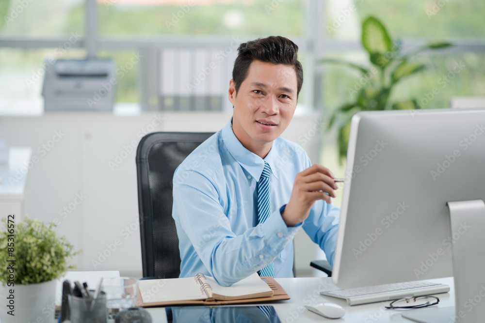 Pointing at computer screen Pointing at computer screen