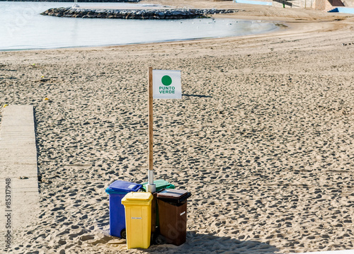 Four garbage containers for separate types of trash photo