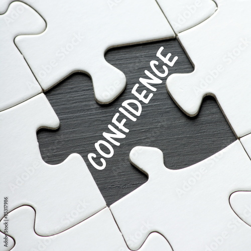 The word confidence revealed by a missing jigsaw puzzle piece
