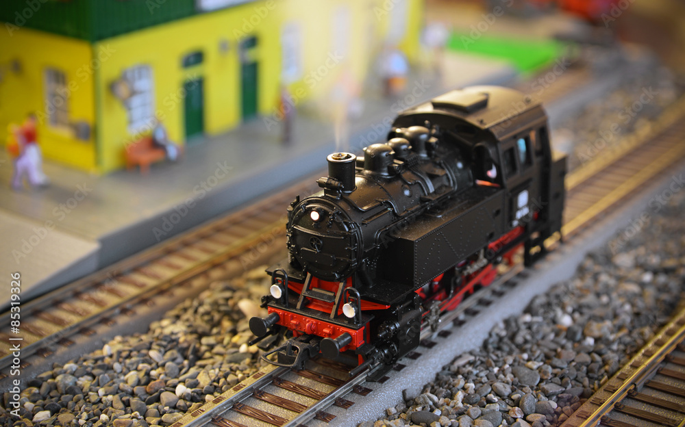 Naklejka premium Model of a steam locomotive with smoke