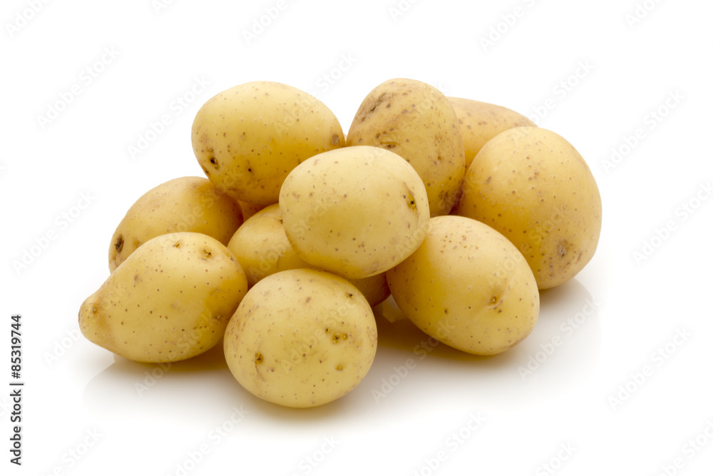 Potatoes on the white background. New harvest. Potatoes on the white background. New harvest.
