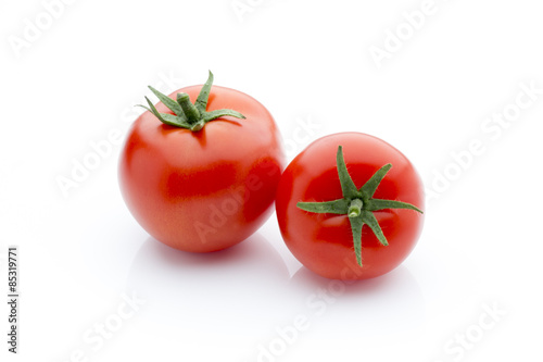 Tomato on the white isolatd background.