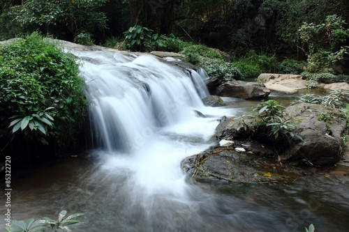 Fototapeta Naklejka Na Ścianę i Meble -  Deep forest waterfall at waterfall National Park, Thailand