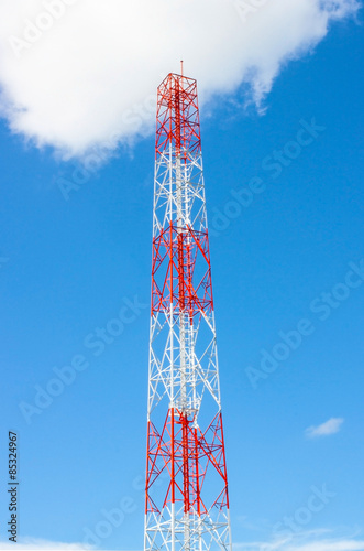 communication tower with blue sky and clouds