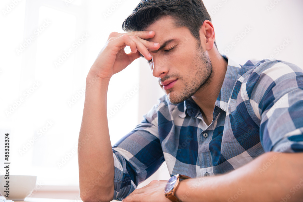 Casual businessman with headache Casual businessman with headache